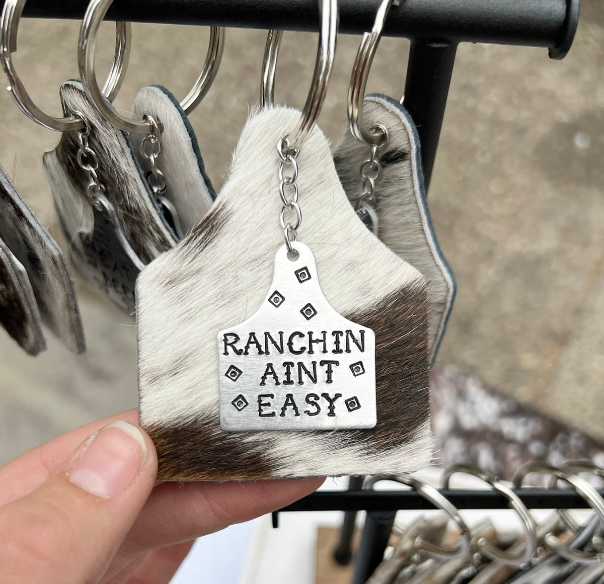 Custom cowhide ear tag keychains rustyadesigns